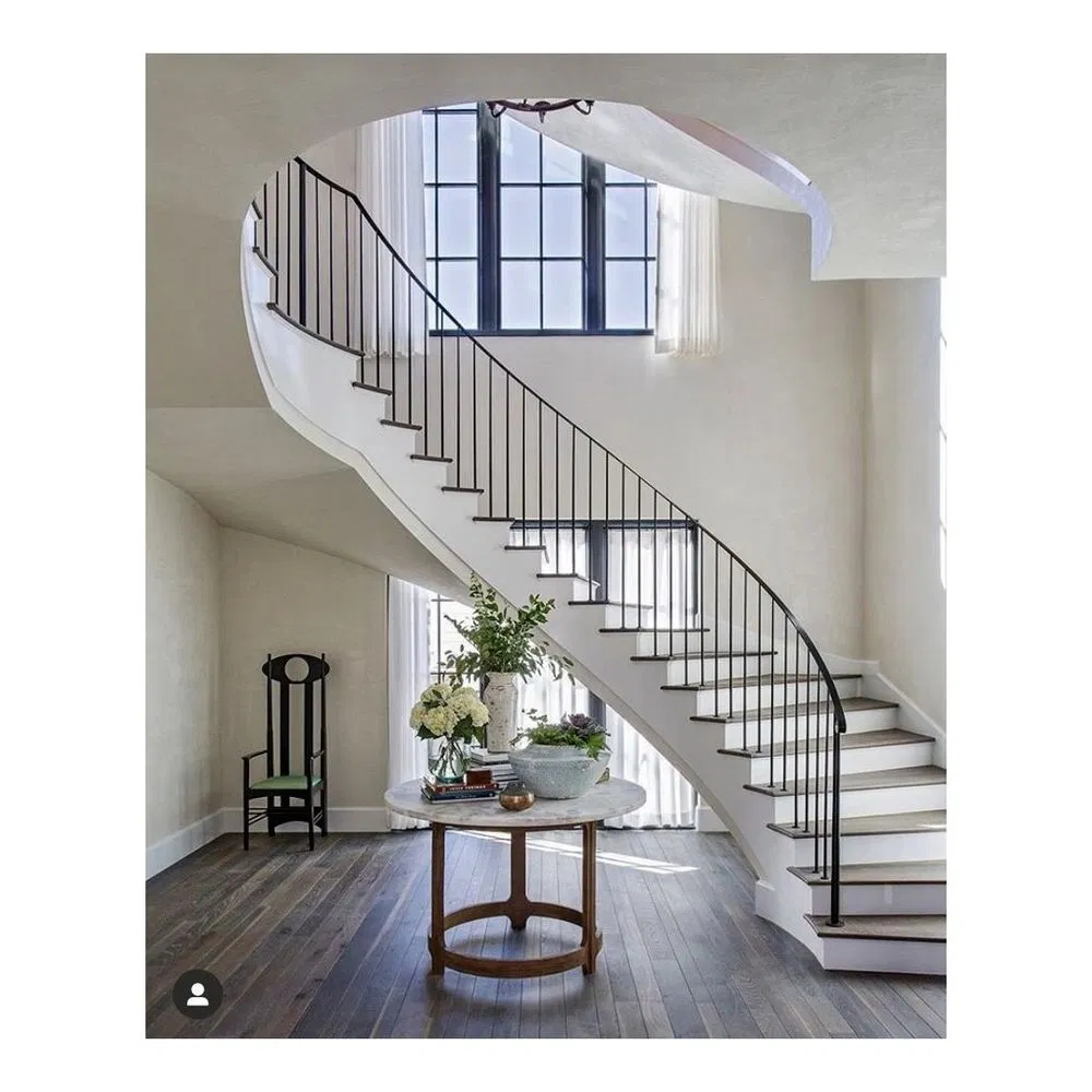 Curved Granite Stair Steps with Wrought Iron Railing